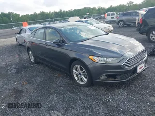 2018 Ford Fusion SE z VIN 3FA6P0HD1JR210207, wystawiony jako IAAI lot #42189899 z przebiegiem 87 815 mil mil oraz . Historia ofert i sprzedaży dostępna na DreamBid. Obrazek 1.