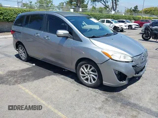 2014 Mazda 5 Sport with VIN JM1CW2BL6E0168795, listed as a IAAI auction lot 42527587 with 145,216 mi miles and . Bid and sale history available at DreamBid. Image 1.
