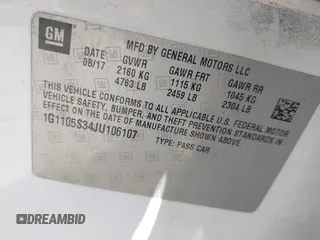 2018 Chevrolet Impala LT with VIN 1G1105S34JU106107, listed as a IAAI auction lot 41871693 with 111,412 mi miles and . Bid and sale history available at DreamBid. Image 9.
