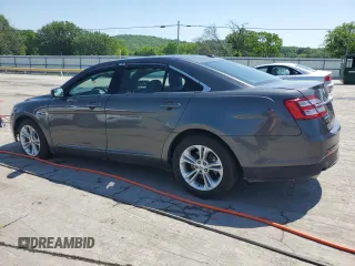 2015 Ford Taurus SEL z VIN 1FAHP2E83FG125234, wystawiony jako Copart lot #54404745 z przebiegiem 107 311 mil mil oraz Szkody całkowita. Historia ofert i sprzedaży dostępna na DreamBid. Obrazek 2.