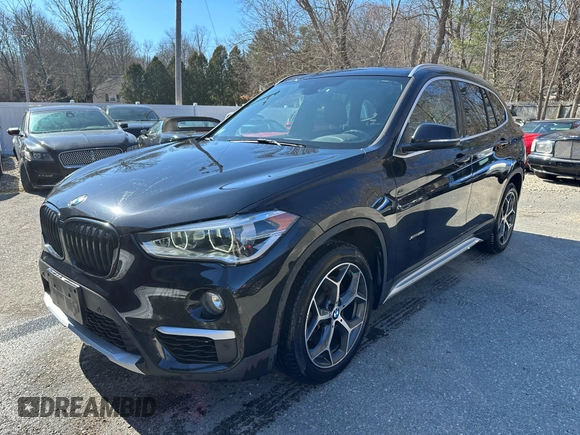 2017 BMW X1 xDrive28i with VIN WBXHT3C32H5F67896, listed as a IAAI auction lot 41823288 with 80,130 mi miles. Bid and sale history available at carsss.com. Image 2.