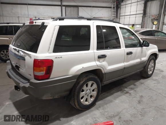 2000 Jeep Grand Cherokee Laredo z VIN 1J4GW48NXYC244327, wystawiony jako IAAI lot #41832166 z przebiegiem 250 822 mil mil oraz . Historia ofert i sprzedaży dostępna na DreamBid. Obrazek 4.