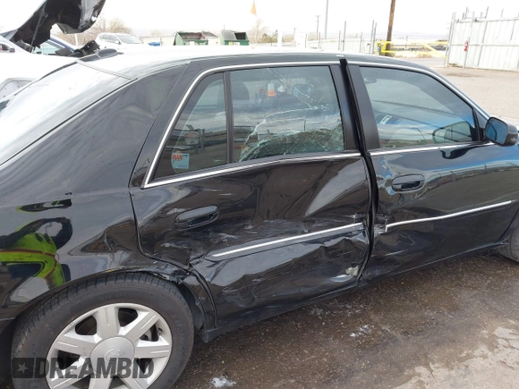 2006 Cadillac DTS w/1SC with VIN 1G6KD57Y96U251691, listed as a IAAI auction lot 41086147 with 128,959 mi miles. Bid and sale history available at carsss.com. Image 6.