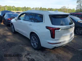 2022 Cadillac XT6 Premium Luxury z VIN 1GYKPDRS3NZ124924, wystawiony jako IAAI lot #42215418 z przebiegiem 32 368 mil mil oraz . Historia ofert i sprzedaży dostępna na DreamBid. Obrazek 3.