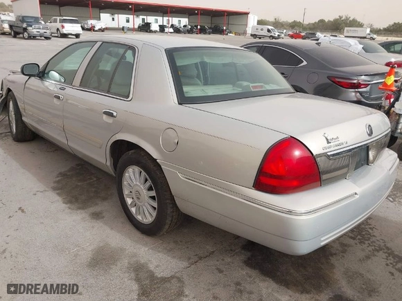 2010 Mercury Grand Marquis LS with VIN 2MEBM7FV5AX633703, listed as a IAAI auction lot 41728720 with 1 mi miles. Bid and sale history available at carsss.com. Image 3.