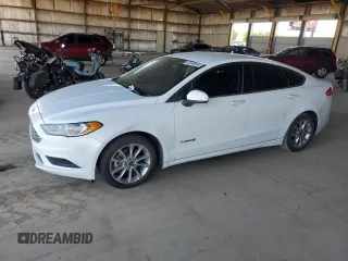 2017 Ford Fusion Hybrid SE z VIN 3FA6P0LU1HR354955, wystawiony jako Copart lot #66654895 z przebiegiem 179 844 mil mil oraz Czysty tytuł • Clean title. Historia ofert i sprzedaży dostępna na DreamBid. Obrazek 1.