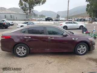 2016 Kia Optima LX with VIN 5XXGT4L30GG075759, listed as a IAAI auction lot 42024856 with 113,740 mi miles. Bid and sale history available at carsss.com. Image 13.
