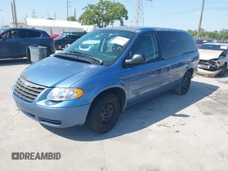 2007 Chrysler Town & Country LWB LX with VIN 2A4GP44R77R246063, listed as a IAAI auction lot 42025571 with 302,541 mi miles. Bid and sale history available at carsss.com. Image 2.