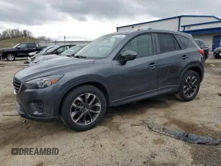 2016 Mazda CX-5 Grand Touring z VIN JM3KE4DY6G0828296, wystawiony jako Copart lot #55137445 z przebiegiem 113 013 mil mil oraz Czysty tytuł • Clean title. Historia ofert i sprzedaży dostępna na DreamBid. Obrazek 1.