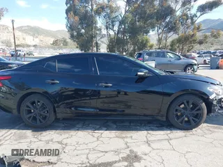 2018 Nissan Maxima S with VIN 1N4AA6AP9JC388366, listed as a IAAI auction lot 41842042 with 103,597 mi miles and . Bid and sale history available at DreamBid. Image 14.