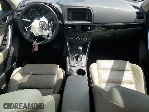 2015 Mazda CX-5 Grand Touring with VIN JM3KE4DY0F0458719, listed as a Copart auction lot 52960365 with 128,372 mi miles and Salvage Title. Bid and sale history available at DreamBid. Image 8.