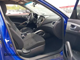2014 Hyundai Veloster with VIN KMHTC6AD2EU184927, listed as a IAAI auction lot 42133499 with 103,499 mi miles. Bid and sale history available at carsss.com. Image 5.