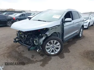 2020 Ford Edge Titanium z VIN 2FMPK4K95LBA16379, wystawiony jako IAAI lot #41190704 z przebiegiem 69 076 mil mil oraz . Historia ofert i sprzedaży dostępna na DreamBid. Obrazek 2.