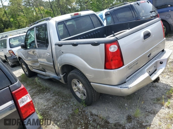 2004 Ford Explorer Sport Trac XLS with VIN 1FMZU67K24UB65144, listed as a Copart auction lot 52611305 with 211,806 mi miles and Salvage title. Bid and sale history available at DreamBid. Image 2.