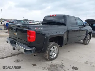 2014 Chevrolet Silverado 1500 LT with VIN 3GCUKREC5EG493728, listed as a IAAI auction lot 41710490 with 243,509 mi miles. Bid and sale history available at carsss.com. Image 4.