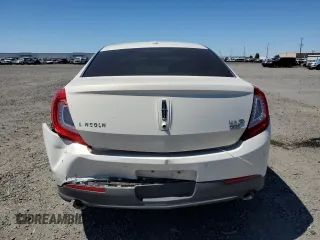 2013 Lincoln MKS с VIN 1LNHL9EK8DG610553, выставлен на аукционе Copart как лот 59160125 с пробегом 128 846 миль миль и Списание • Salvage title. История ставок и продаж доступна на DreamBid. Изображение 6.