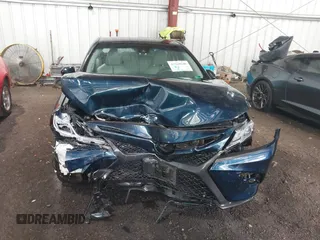 2018 Toyota Camry LE z VIN 4T1B11HK8JU517019, wystawiony jako IAAI lot #42220646 z przebiegiem 98 924 mil mil oraz . Historia ofert i sprzedaży dostępna na DreamBid. Obrazek 11.