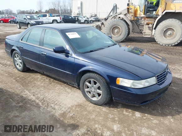 1999 Cadillac Seville Touring STS z VIN 1G6KY5493XU913994, wystawiony jako IAAI lot #41780695 z przebiegiem 60 375 mil mil oraz . Historia ofert i sprzedaży dostępna na DreamBid. Obrazek 1.