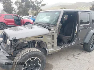 2014 Jeep Wrangler Unlimited Sport with VIN 1C4BJWDG7EL244749, listed as a IAAI auction lot 41871127 with 128,420 mi miles and . Bid and sale history available at DreamBid. Image 6.