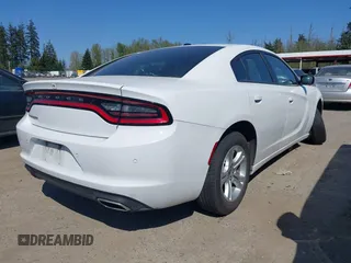 2022 Dodge Charger SXT with VIN 2C3CDXBG4NH197301, listed as a IAAI auction lot 42053688 with 60,592 mi miles and . Bid and sale history available at DreamBid. Image 4.