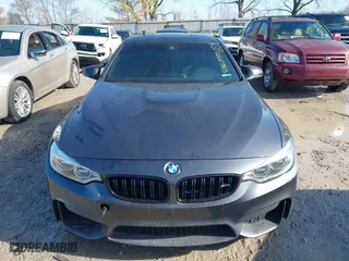 2015 BMW M4 with VIN WBS3R9C57FK334921, listed as a IAAI auction lot 41869773 with 107,058 mi miles. Bid and sale history available at carsss.com. Image 12.