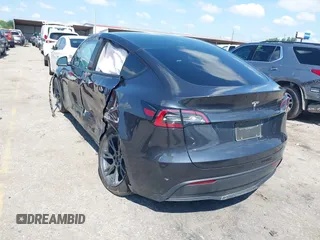 2024 Tesla Model Y with VIN 7SAYGDED9RA321373, listed as a IAAI auction lot 42228491 with 6,452 mi miles and . Bid and sale history available at DreamBid. Image 3.