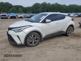 2021 Toyota C-HR LE z VIN NMTKHMBX2MR128051, wystawiony jako Copart lot #56697605 z przebiegiem 87 004 mil mil oraz Szkoda całkowita • Salvage title. Historia ofert i sprzedaży dostępna na DreamBid. Obrazek 1.