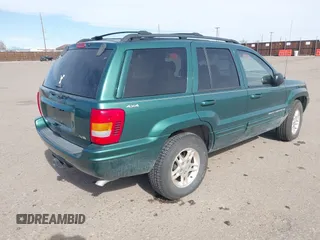 1999 Jeep Grand Cherokee Limited with VIN 1J4GW68N4XC544651, listed as a IAAI auction lot 41742346 with 94,904 mi miles and . Bid and sale history available at DreamBid. Image 4.