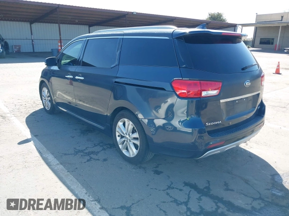 2016 Kia Sedona SX-L with VIN KNDME5C15G6083811, listed as a IAAI auction lot 41932863 with 124,218 mi miles. Bid and sale history available at carsss.com. Image 3.