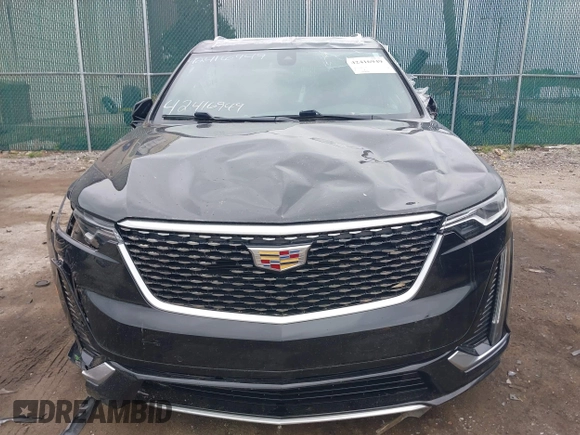 2020 Cadillac XT6 FWD Premium Luxury z VIN 1GYKPCRS6LZ148058, wystawiony jako IAAI lot #42416949 z przebiegiem 79 318 mil mil oraz . Historia ofert i sprzedaży dostępna na DreamBid. Obrazek 12.