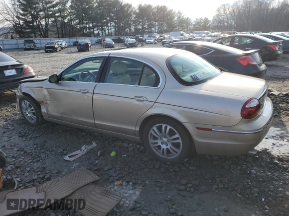 2005 Jaguar S-Type with VIN SAJWA01T55FN14254, listed as a Copart auction lot 86994974 with 126,484 mi miles and Salvage Title. Bid and sale history available at DreamBid. Image 2.