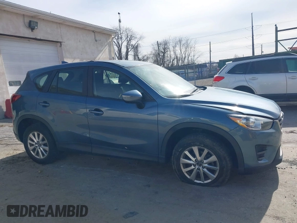 2016 Mazda CX-5 Sport with VIN JM3KE4BY0G0746034, listed as a IAAI auction lot 41842894 with 92,801 mi miles. Bid and sale history available at carsss.com. Image 13.