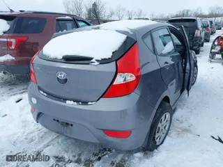 2014 Hyundai Accent GS with VIN KMHCT5AE1EU194495, listed as a IAAI auction lot 41609591 with 85,737 mi miles. Bid and sale history available at carsss.com. Image 4.