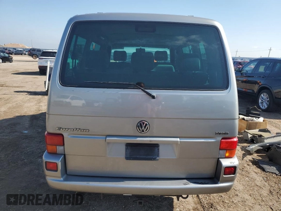 2000 Volkswagen EuroVan с VIN WV2MH4703YH013265, выставлен на аукционе Copart как лот 59003645 с пробегом Не указан миль и Списание • Salvage title. История ставок и продаж доступна на DreamBid. Изображение 6.