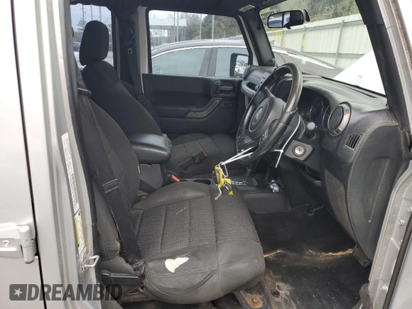 2012 Jeep Wrangler Unlimited Sport RHD with VIN 1C4BJWKG3CL220996, listed as a Copart auction lot 87860055 with 175,725 mi miles and Clean title. Bid and sale history available at DreamBid. Image 7.