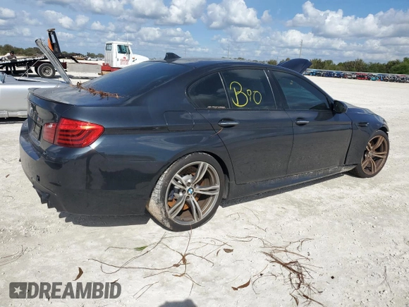 2014 BMW M5 with VIN WBSFV9C54ED097865, listed as a Copart auction lot 79897384 with 0 mi miles and Salvage Title. Bid and sale history available at carsss.com. Image 3.