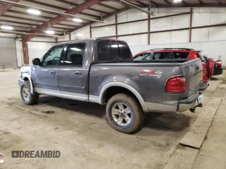 2002 Ford F-150 XLT with VIN 1FTRW08L92KD19411, listed as a Copart auction lot 50986795 with 164,556 mi miles and Clean Title. Bid and sale history available at carsss.com. Image 2.