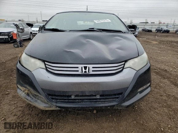 2010 Honda Insight LX with VIN JHMZE2H56AS022299, listed as a Copart auction lot 54872215 with 149,514 mi miles and Salvage title. Bid and sale history available at DreamBid. Image 5.
