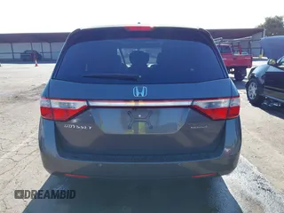 2012 Honda Odyssey Touring with VIN 5FNRL5H95CB057346, listed as a IAAI auction lot 42644094 with 114,712 mi miles and . Bid and sale history available at DreamBid. Image 17.
