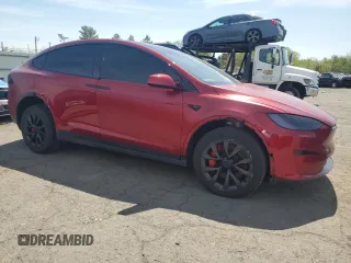 2023 Tesla Model X Plaid with VIN 7SAXCBE66PF427020, listed as a Copart auction lot 53890405 with 30,575 mi miles and Salvage Title. Bid and sale history available at DreamBid. Image 4.