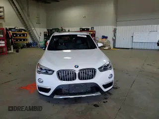 2017 BMW X1 xDrive28i with VIN WBXHT3Z38H4A53824, listed as a Copart auction lot 52500215 with 106,782 mi miles and Salvage title. Bid and sale history available at DreamBid. Image 11.