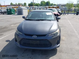 2015 Scion tC with VIN JTKJF5C71FJ013747, listed as a IAAI auction lot 42087740 with 138,097 mi miles. Bid and sale history available at carsss.com. Image 12.