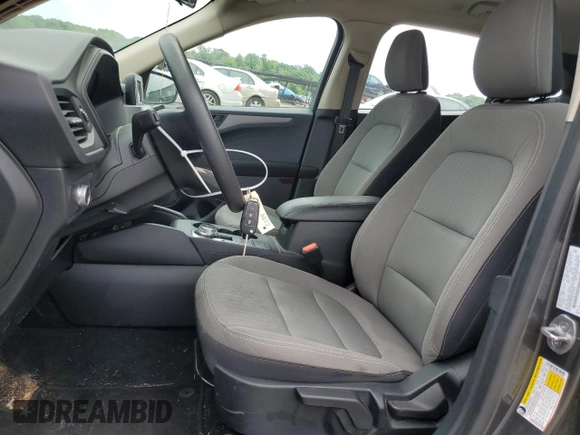 2020 Ford Escape S with VIN 1FMCU9F63LUA19619, listed as a Copart auction lot 57279464 with 85,595 mi miles and Salvage title. Bid and sale history available at DreamBid. Image 7.