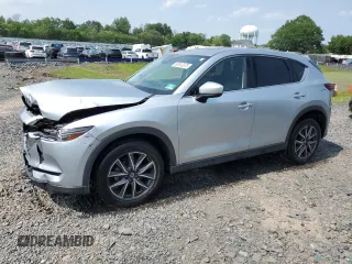 2018 Mazda CX-5 Grand Touring with VIN JM3KFBDM1J0342002, listed as a Copart auction lot 60613375 with 82,794 mi miles and Salvage title. Bid and sale history available at DreamBid. Image 1.