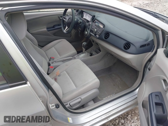 2010 Honda Insight LX with VIN JHMZE2H57AS008203, listed as a IAAI auction lot 42240869 with 150,562 mi miles and . Bid and sale history available at DreamBid. Image 5.