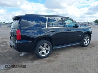 2015 Chevrolet Tahoe LT with VIN 1GNSCBKCXFR214072, listed as a IAAI auction lot 40512435 with 98,955 mi miles and . Bid and sale history available at DreamBid. Image 4.