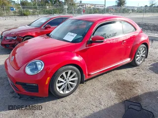 2018 Volkswagen Beetle S with VIN 3VWFD7AT5JM725878, listed as a IAAI auction lot 41743855 with 108,068 mi miles. Bid and sale history available at carsss.com. Image 2.