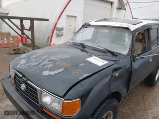 1996 Toyota Land Cruiser with VIN JT3HJ85J4T0115628, listed as a IAAI auction lot 41191476 with 210,005 mi miles. Bid and sale history available at carsss.com. Image 6.