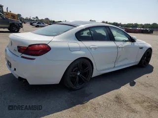 2015 BMW M6 z VIN WBS6C9C5XFD467711, wystawiony jako Copart lot #66574644 z przebiegiem 101 001 mil mil oraz Szkody całkowita. Historia ofert i sprzedaży dostępna na DreamBid. Obrazek 3.