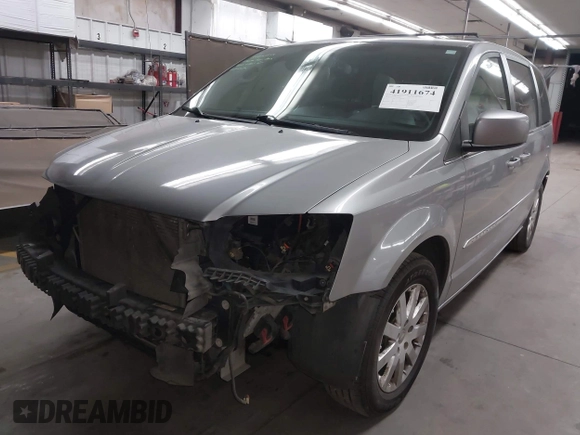 2013 Chrysler Town & Country Touring with VIN 2C4RC1BG7DR730420, listed as a IAAI auction lot 41911674 with 179,810 mi miles and . Bid and sale history available at DreamBid. Image 2.